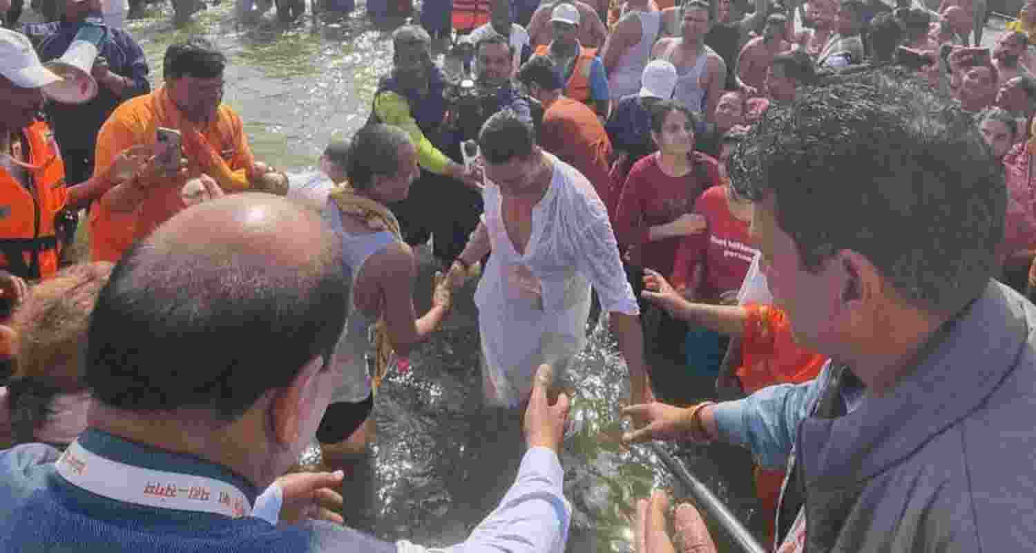 Bollywood actor Akshay Kumar takes a dip at the Sangam during the ongoing Mahakumbh Mela, in Prayagraj, UP, Monday.