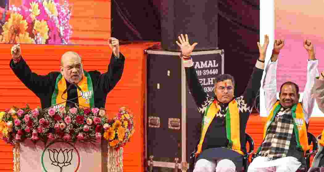 Union Home Minister Amit Shah addresses at the 'Jhuggi Basti Pradhan Sammelan', in New Delhi, Saturday.