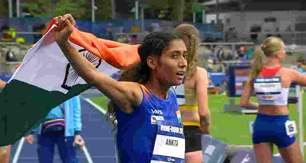Ankita celebrates draped in the Indian flag after clocking a personal-best 9:31.99s to secure silver in the women’s 3000m steeplechase at the World University Games in Rhine-Ruhr on Saturday.