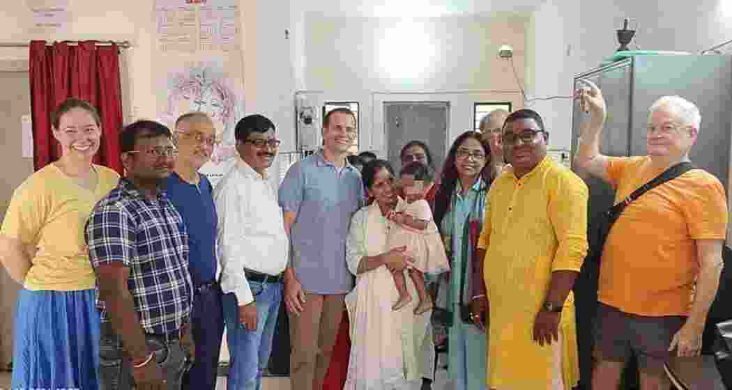 Arizona couple Todd Bank and his sister complete the adoption of a 15-month-old girl from Dhanbad, marking a second international adoption from the district.