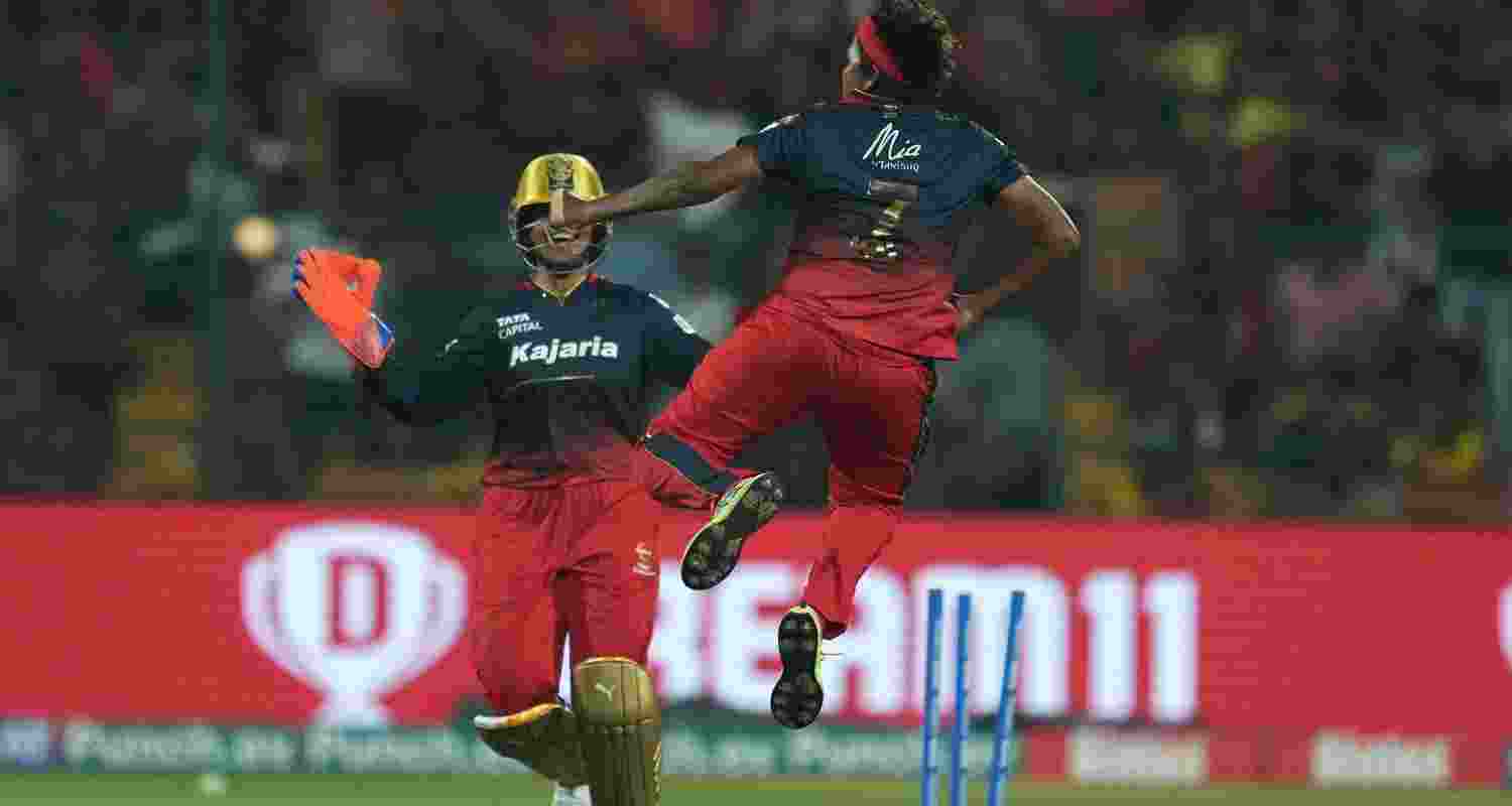 Royal Challengers Bangalore's Asha Shobana celebrates the wicket of UP Warriorz' Tahlia McGrath during the 2nd Women's Premier League (WPL) 2024 T20 cricket match between Royal Challengers Bangalore and UP Warriorz, at M Chinnaswamy Stadium, in Bengaluru, Saturday.