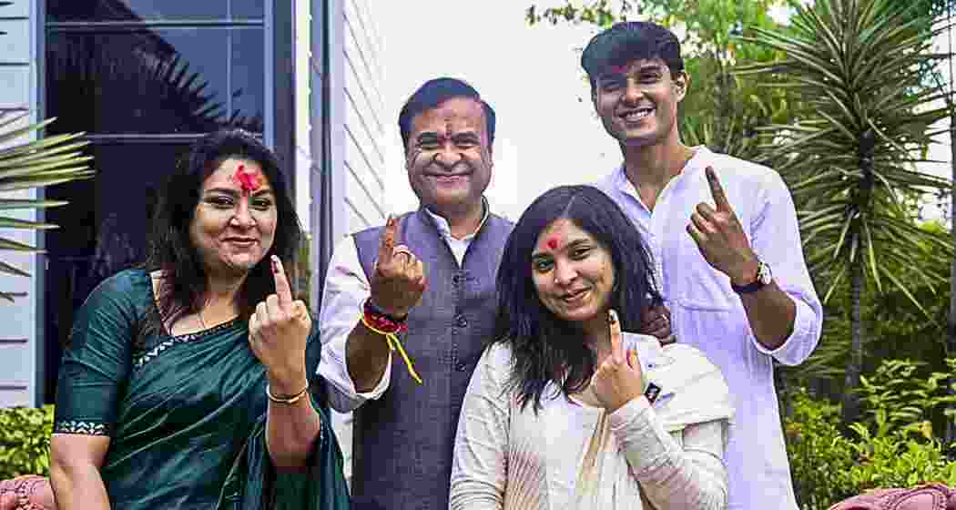  Assam Chief Minister Himanta Biswa Sarma and his family members show their ink-marked fingers after casting votes at Jalukbari constituency during the state Assembly elections, in Kamrup district. (@himantabiswa/X via PTI Photo)