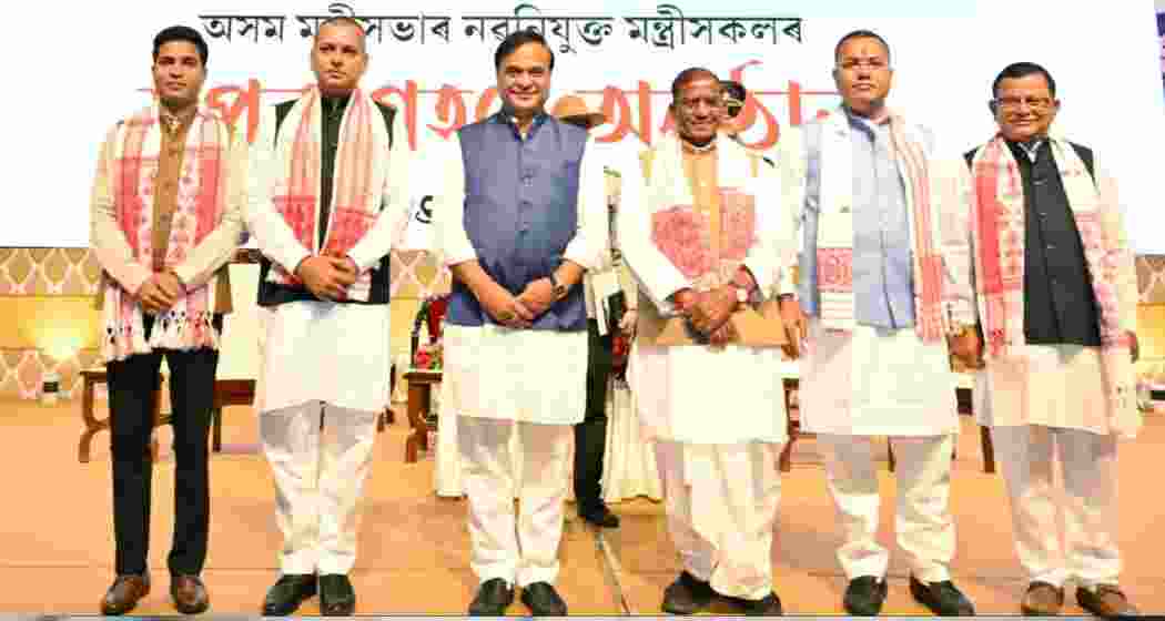 Governor Laxman Prasad Acharya along with CM Himanta Biswa Sarma and Assam’s new ministers.
