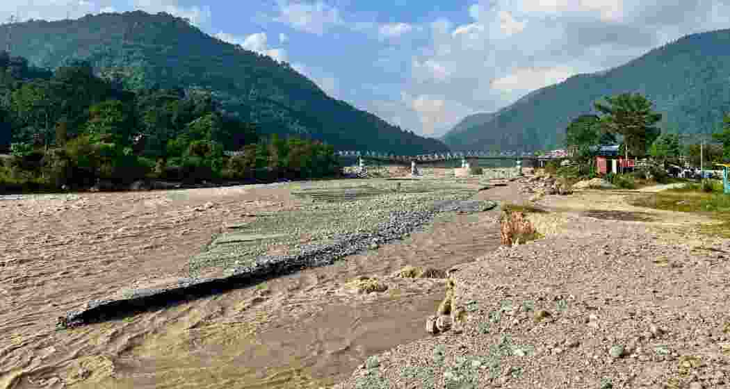 A furious Balason river rushes beneath the damaged Iron Bridge at Dudhiya in Darjeeling district, West Bengal, after heavy rains swept away homes and families along its banks. A furious Balason river rushes beneath the damaged Iron Bridge at Dudhiya in Darjeeling district, West Bengal, after heavy rains swept away homes and families along its banks.