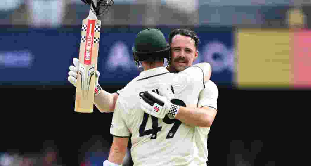 Travis Head celebrates his century alongside Steve Smith, as their 241-run partnership puts Australia in a commanding position on day two of the third Test against India in Bhubaneswar.