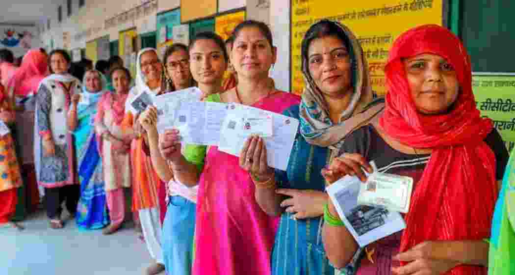 Women voters in Bihar stand in a queue during the 2024 Assembly elections.