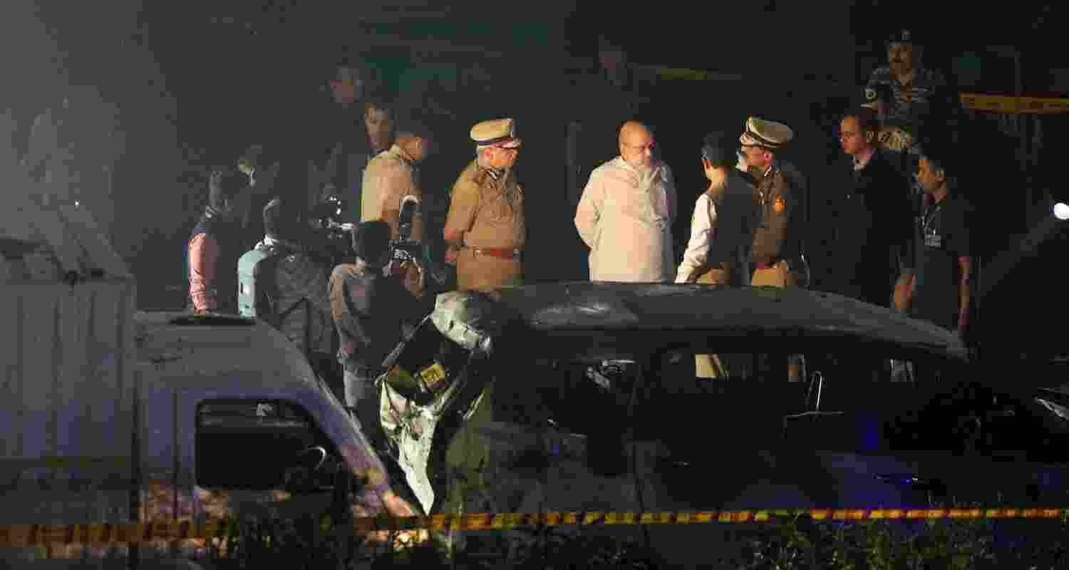 Union Home Minister Amit Shah visits the blast site near Red Fort, in New Delhi, Monday.