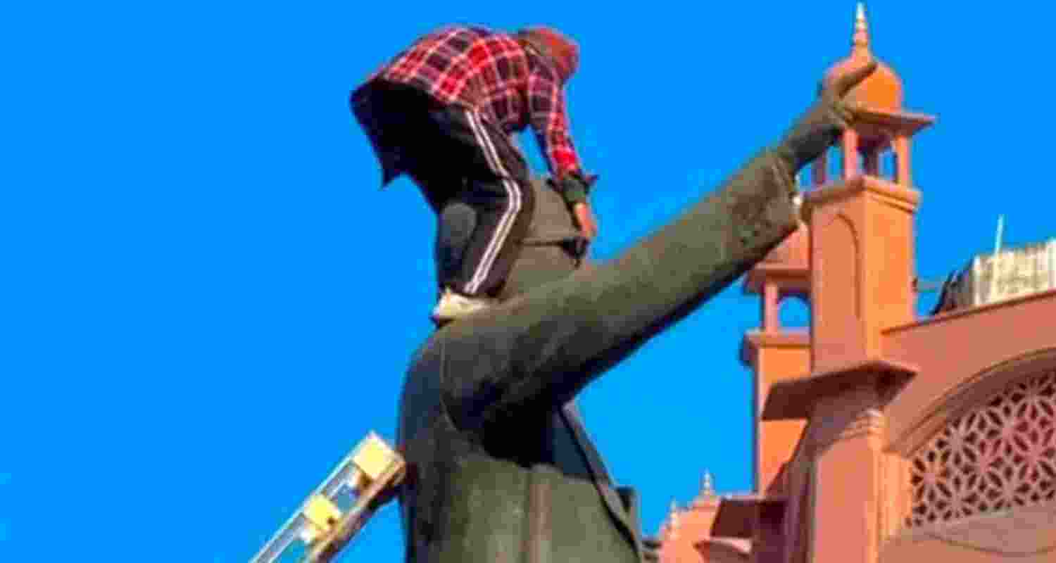 A man tries to vandalise the statue of BR Ambedkar adjacent to Golden Temple, in Amritsar's Heritage Street. 