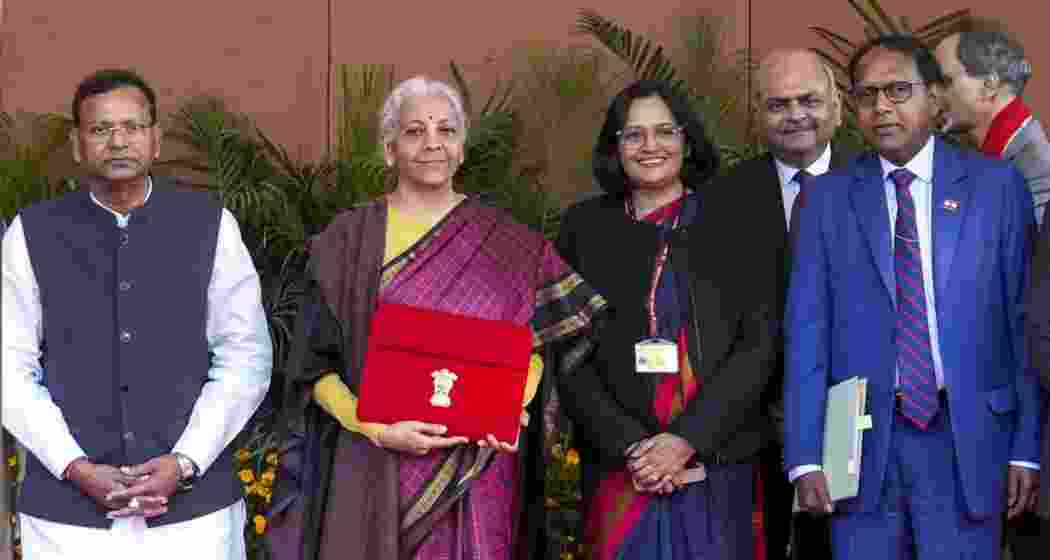Finance Minister Nirmala Sitharaman poses with her Budget team, and senior officials of the Ministry of Finance, outside Kartavya Bhavan before heading to Rashtrapati Bhavan and Parliament to present the Union Budget 2026-27.