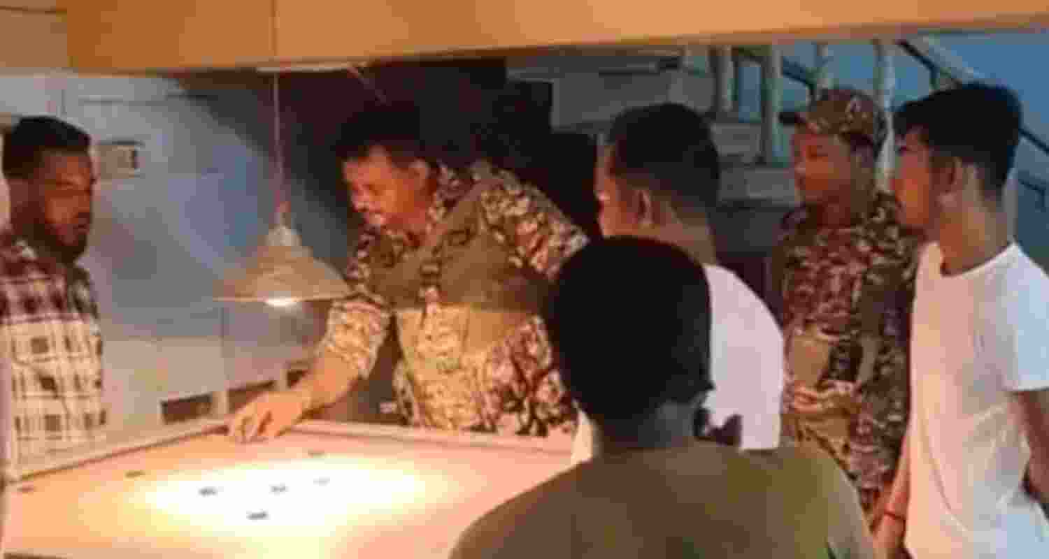In the footage, three men in uniform can be seen gathered around a carrom board, with one of them even taking a shot. 
