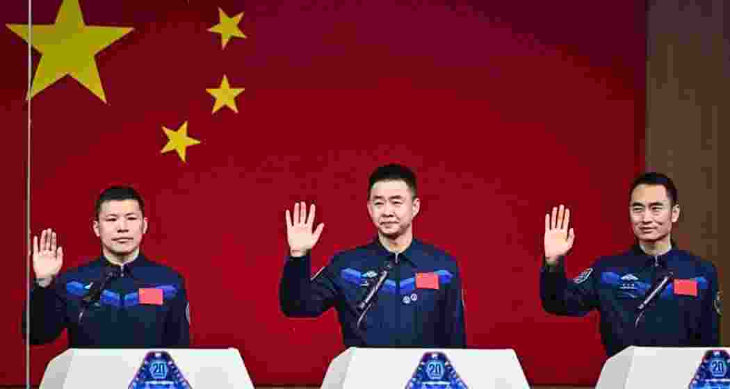 Astronauts Chen Dong, Chen Zhongrui, and Wang Jie pose before boarding the Shenzhou-20 mission to China’s Tiangong space station, launched on the country’s 10th National Space Day on Thursday.