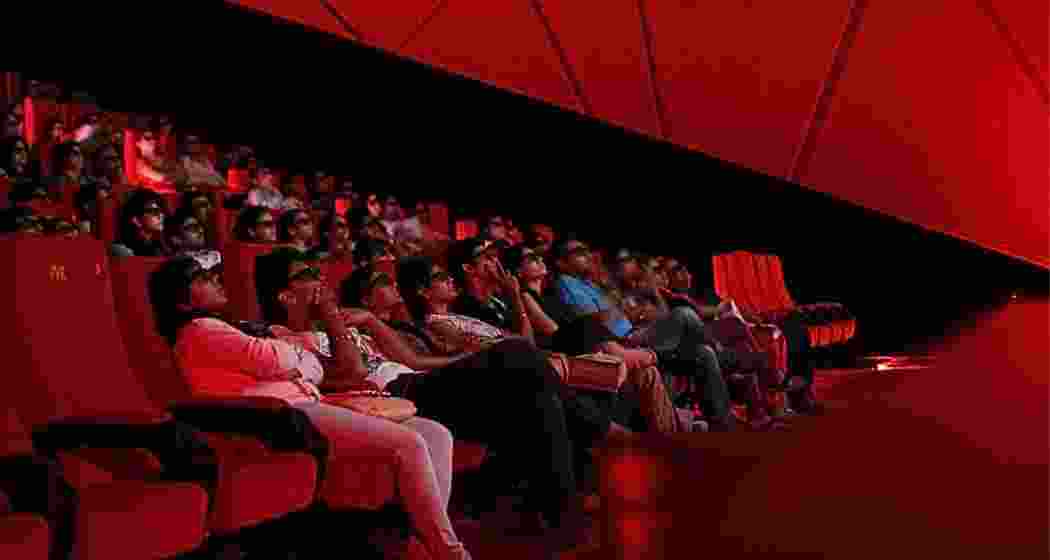 People enjoy a movie at a cinema hall in Kolkata, West Bengal. 