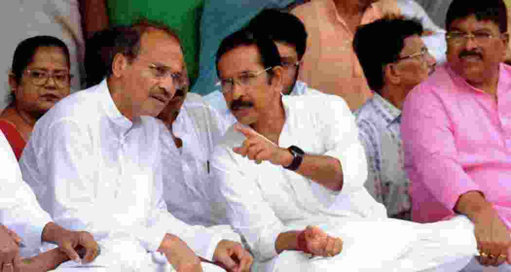 West Bengal Congress president Subhankar Sarkar (R), interacts with former state unit chief Adhir Ranjan Chowdhury.