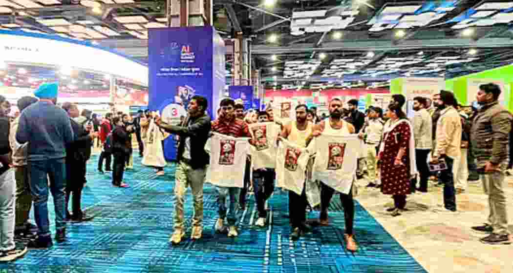 Indian Youth Congress (IYC) workers hold a ‘shirtless protest’ at the AI Impact Summit in New Delhi, displaying T-shirts with slogans against the government and the India-US trade deal on February 20. 