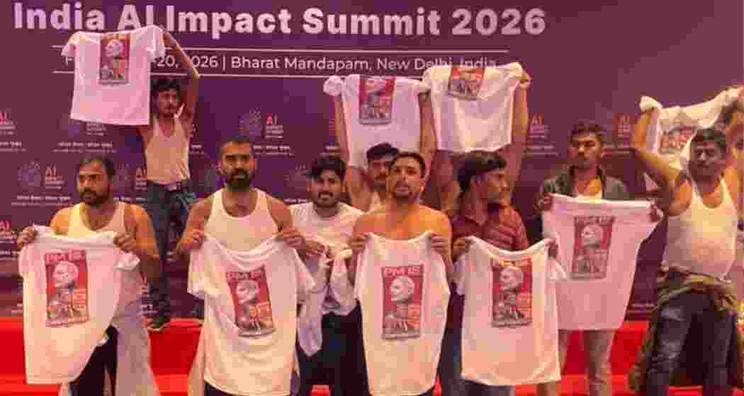 Youth Congress leaders protest shirtless at Bharat Mandapam during the AI Summit in New Delhi.