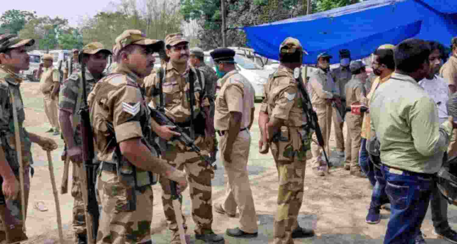 Security force outside a polling station in Cooch Behar.