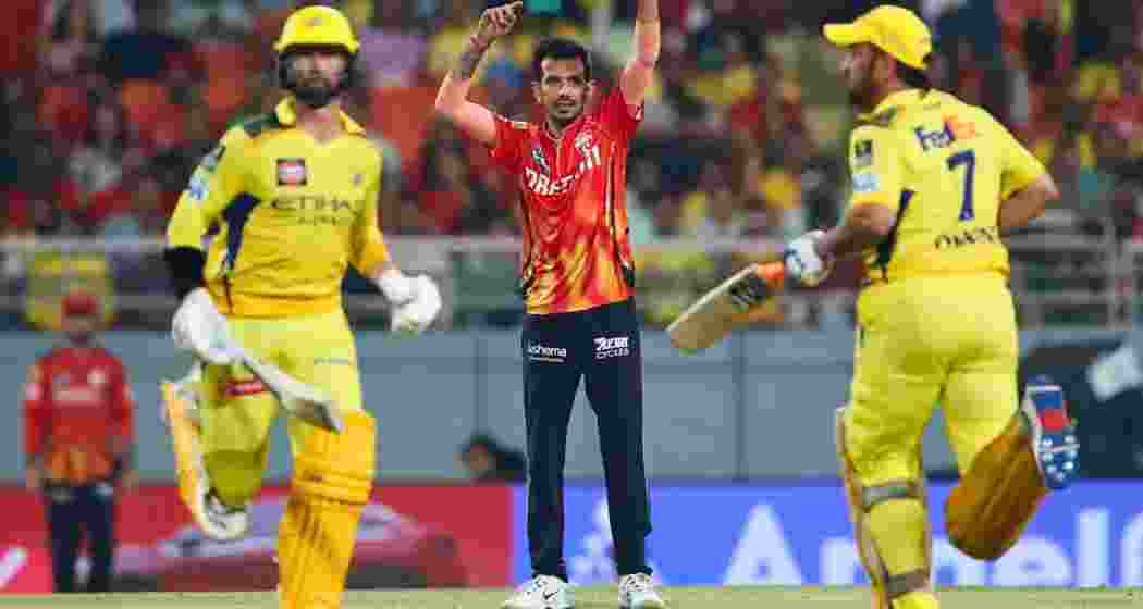 Yuzvendra Chahal watches intently as MS Dhoni plays a shot during Chennai Super Kings’ innings, moments before the veteran was dismissed during Chahal’s match-turning spell in Chennai.