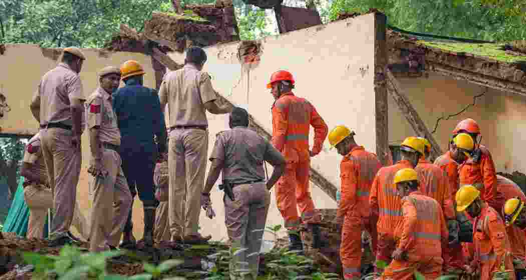 Security personnel at the site after a portion of the structure at Humayun's Tomb collapses, in New Delhi, Friday.