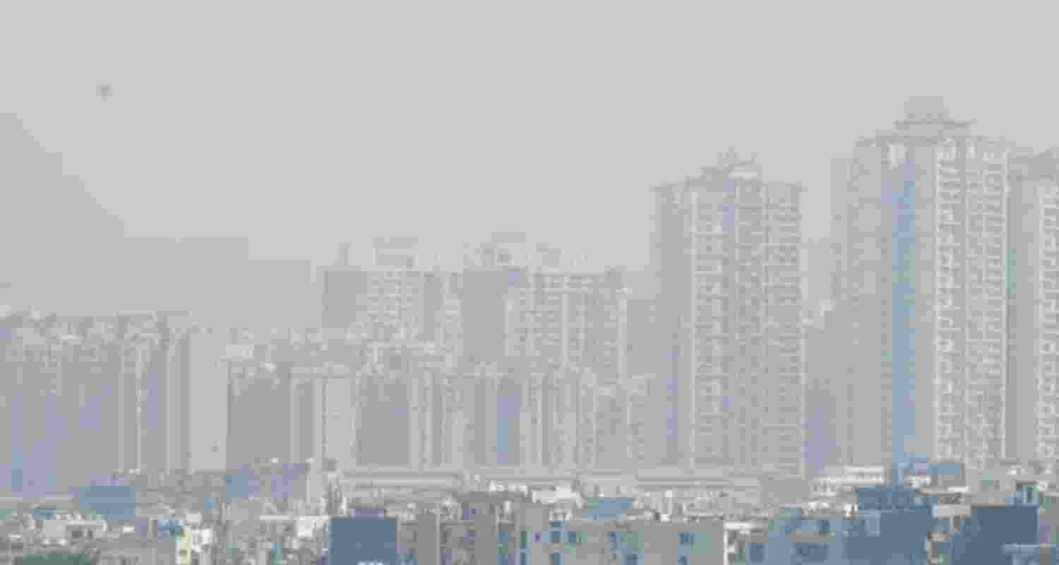 A view of skyscrapers in Noida city shrouded in thick smog on Friday afternoon, ahead of Diwali. Rising pollution levels have reduced visibility and worsened air quality across the Delhi-NCR region, in Noida.