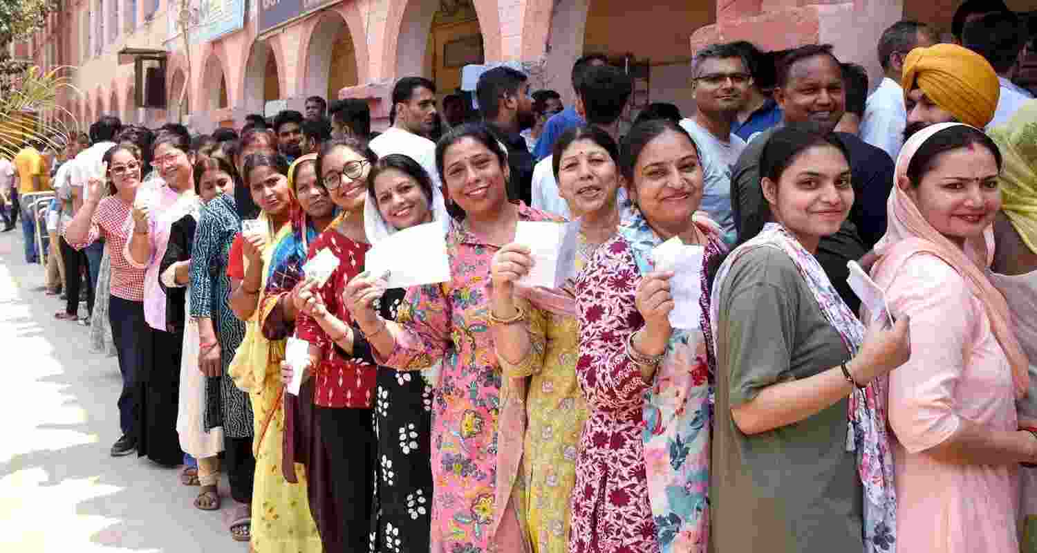 Women line up outside a polling station in New Delhi. File Photo.