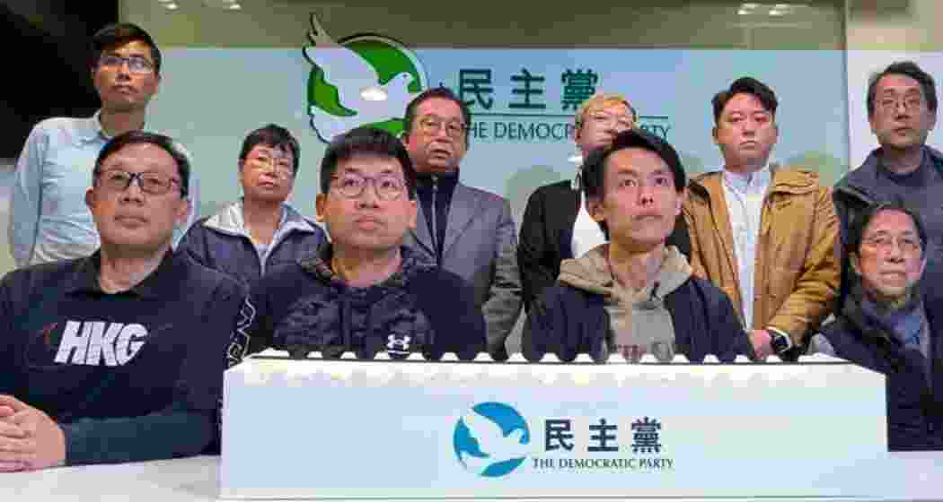 Lo Kin-hei (second from right), chairman of Hong Kong's Democratic Party, joins senior leaders at a press conference held at the party headquarters in Hong Kong.