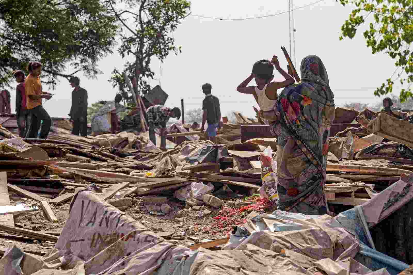 People search for their valuables in the rubbles after a demolition drive at the Sanjay Colony in Chandigarh on Wednesday.