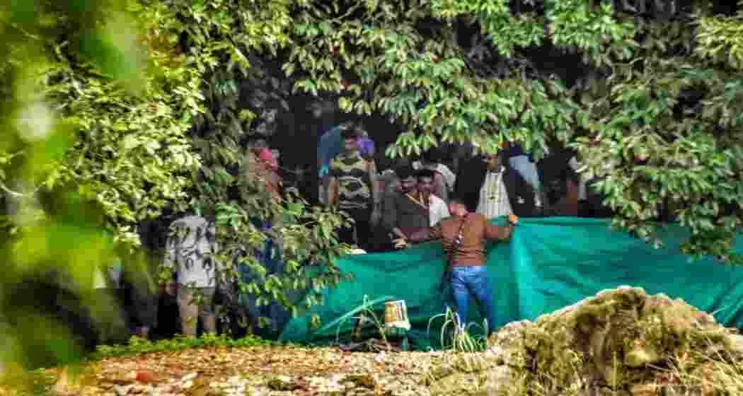 SIT personnel and forensic experts conduct a high-security search at a burial site near Dharmasthala.