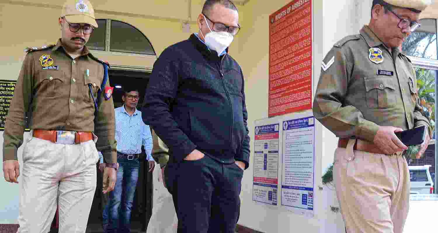 Police Personnel take Nripen Das into custody.