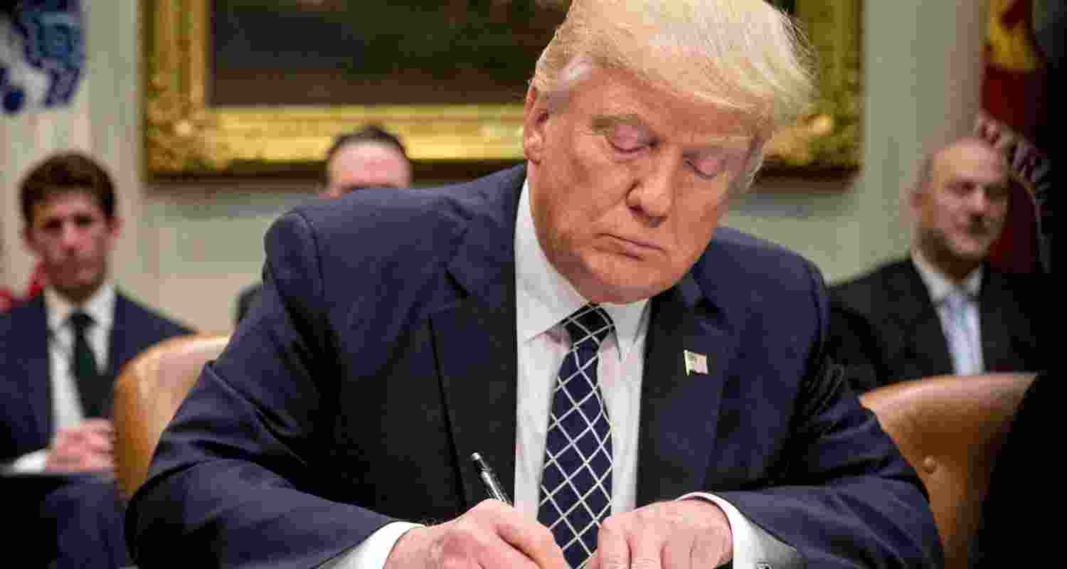 US President Donald Trump signs an executive order. File Photo.