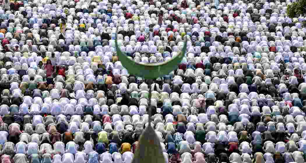 Muslims offer prayers on the aoccassion of 'Eid al-Fitr' festival, in Bengaluru, Karnataka, on Saturday.