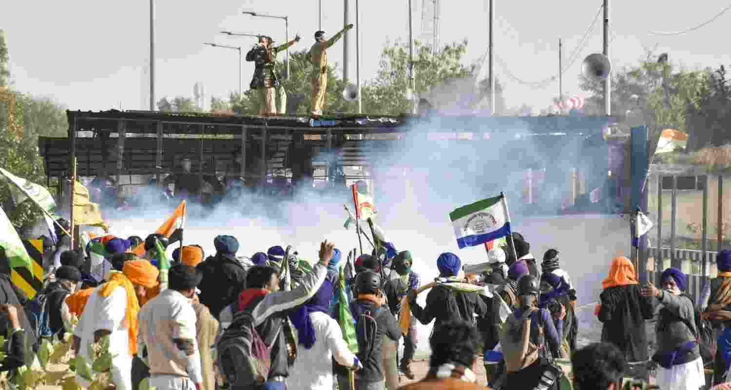 Tear gas being used by security personnel to disperse the farmers moving towards barricades during their foot march to Delhi, at Shambhu border in Patiala district, Punjab, Friday, Dec. 6, 2024. 