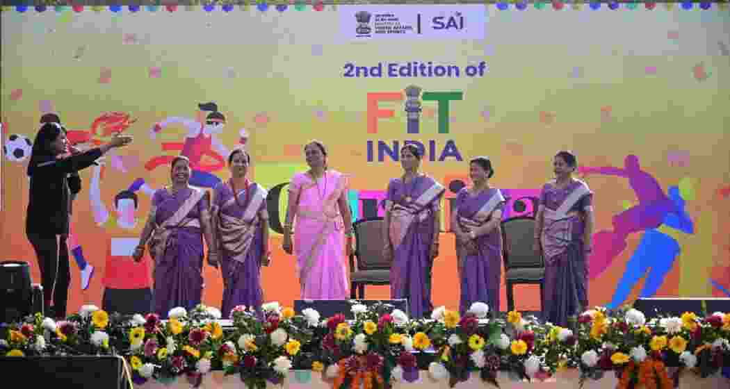 Participants from all age groups take part in fitness activities during the Fit India Carnival at Jawaharlal Nehru Stadium in New Delhi.
