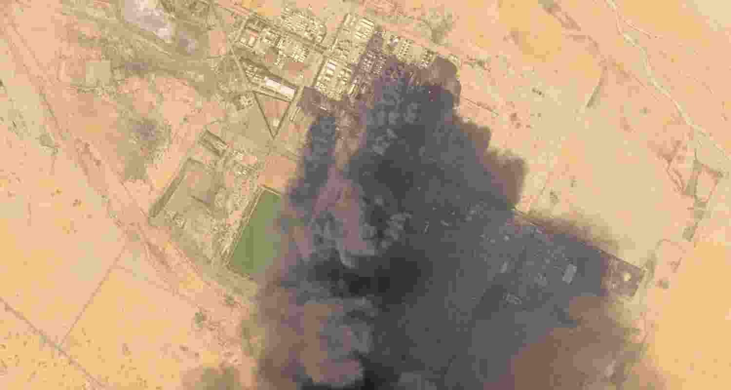 Smoke is seen rising from the Khartoum Oil refinery, in Sudan. The refinery is run by the Sudanese government and China National Petroleum Corp.