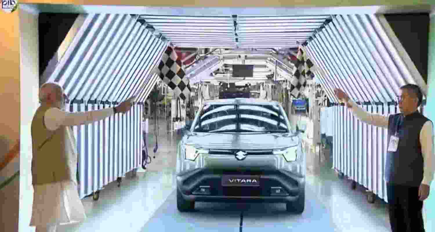 In a big push to India’s ‘Atmanirbhar Bharat’ and ‘Make-in-India’ missions, Prime Minister Narendra Modi flagged of Maruti Suzuki India’s first electric vehicle, e-VITARA, from its Suzuki Motor Gujarat unit in Hansalpur, Ahmedabad, on Tuesday, and also inaugurated the production of lithium-ion battery cells for strong hybrid vehicles at its facility