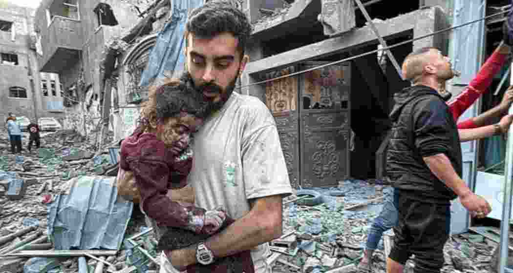 A young child is rescued from the rubble following intense Israeli airstrikes in Gaza. 