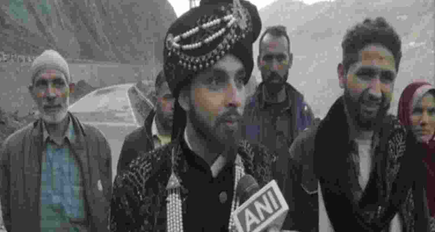 The expectant groom, Hashkhor Ahmad, travels on foot due to closure of NH 44 (Photo/ANI). 