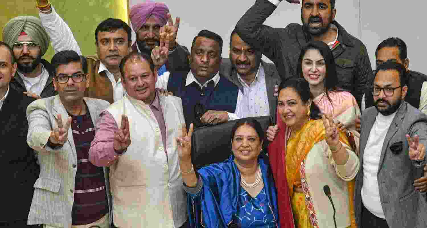 Newly elected mayor of the Chandigarh Municipal Corporation BJP's Harpreet Kaur Babla, in blue, with other party councillors after the announcement of the election results, in Chandigarh, Thursday. 