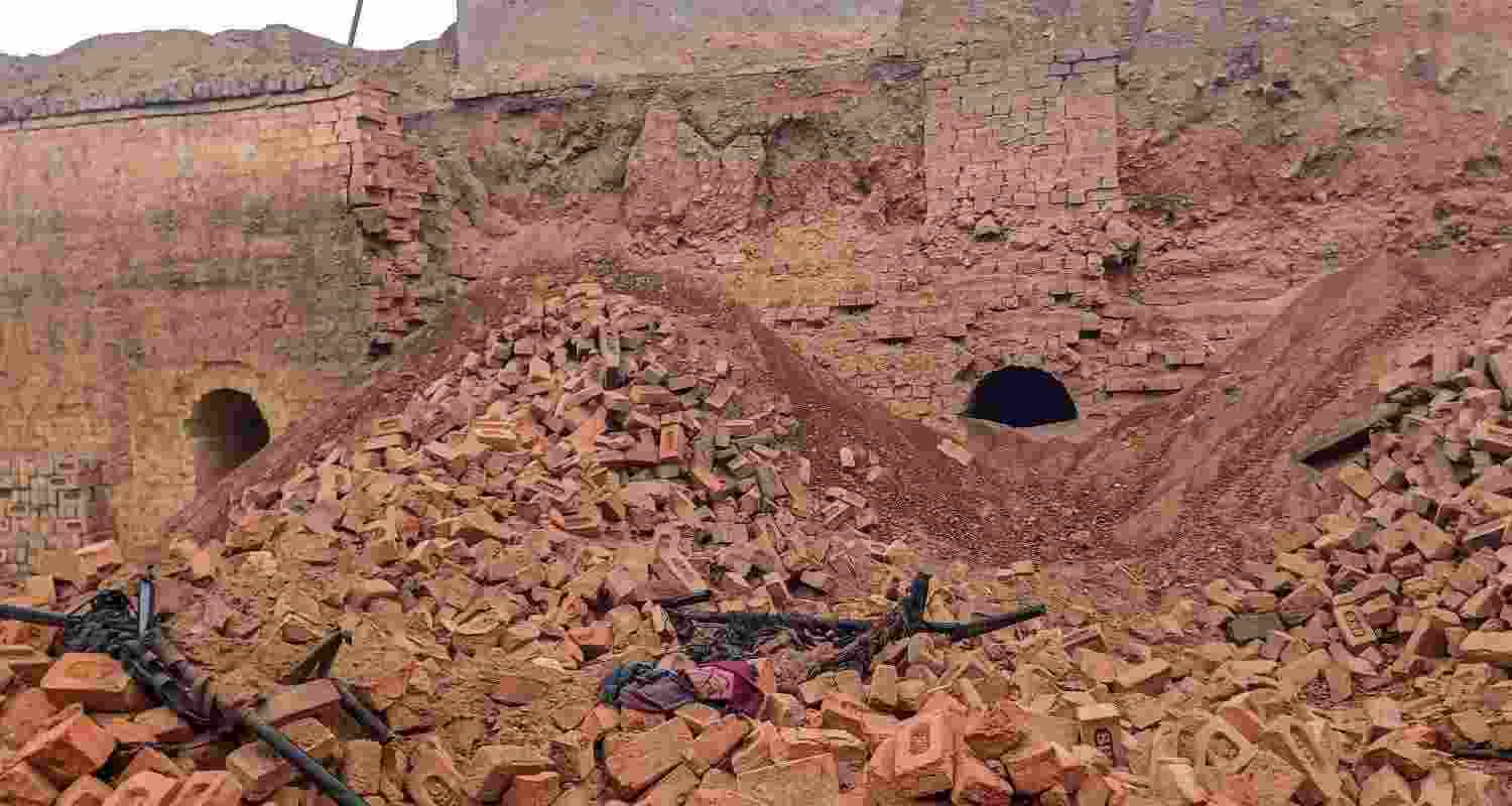 Debris of a wall after it collapsed at a kiln, in Hisar district, Monday. Four children out of the 20 people buried under its debris were killed in the accident. 