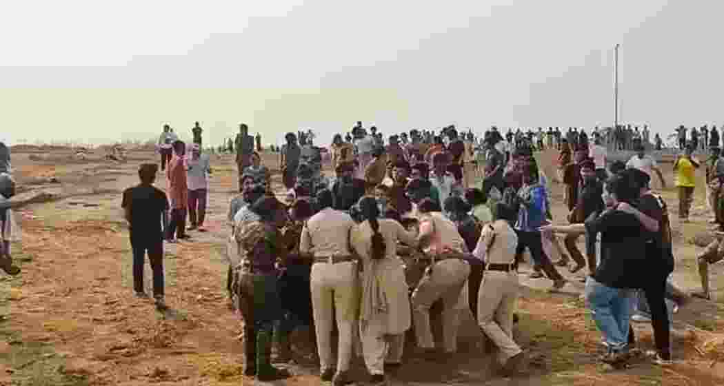University of Hyderabad students clash with police during a protest against the alleged auction of 400 acres of land bordering the campus. Several students were detained before being released.