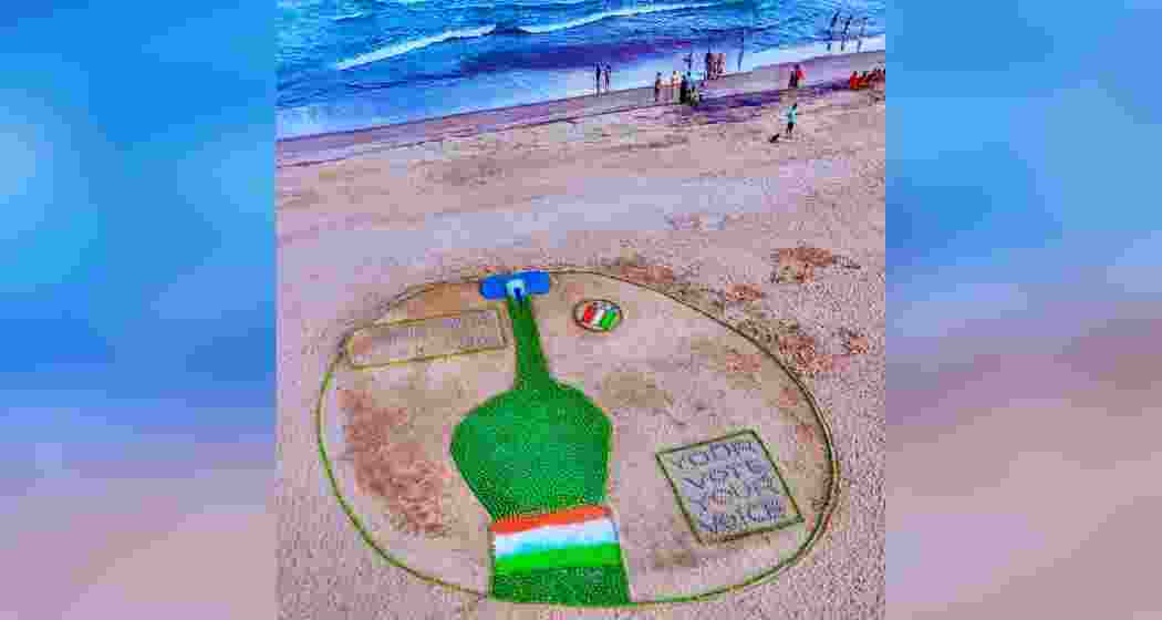 An aerial view of Pattnaik's sand art commemorating the ongoing Lok Sabha and Assembly elections across India.
