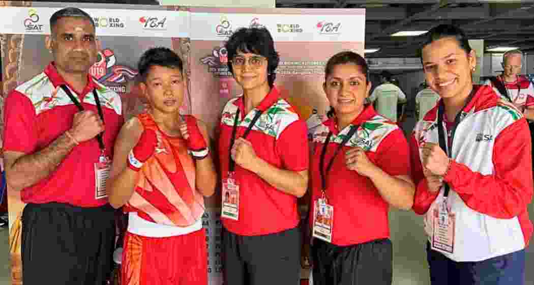 Joyshree Devi Chirom poses with the coaching staff after her win at the World Boxing Futures Cup in Bangkok.