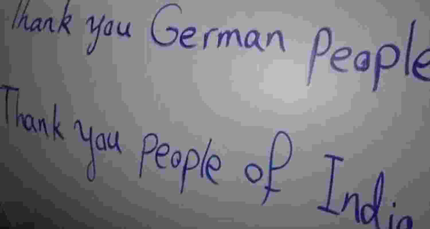 Visuals released by the Iranian Consulate General in Mumbai and state media show members of the Revolutionary Guard’s Aerospace Force using blue markers to write "Thank you to the people of India" on the casings of long-range projectiles before they were fuelled and fired.