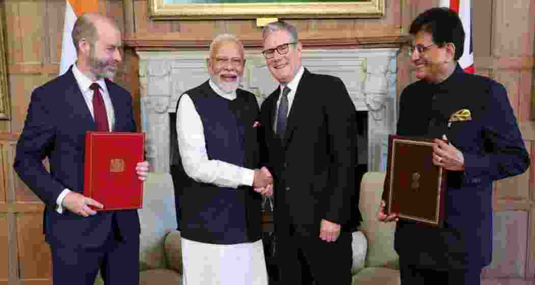 Prime Minister Narendra Modi and UK Prime Minister Keir Starmer along with the Commerce Ministers of both nations.