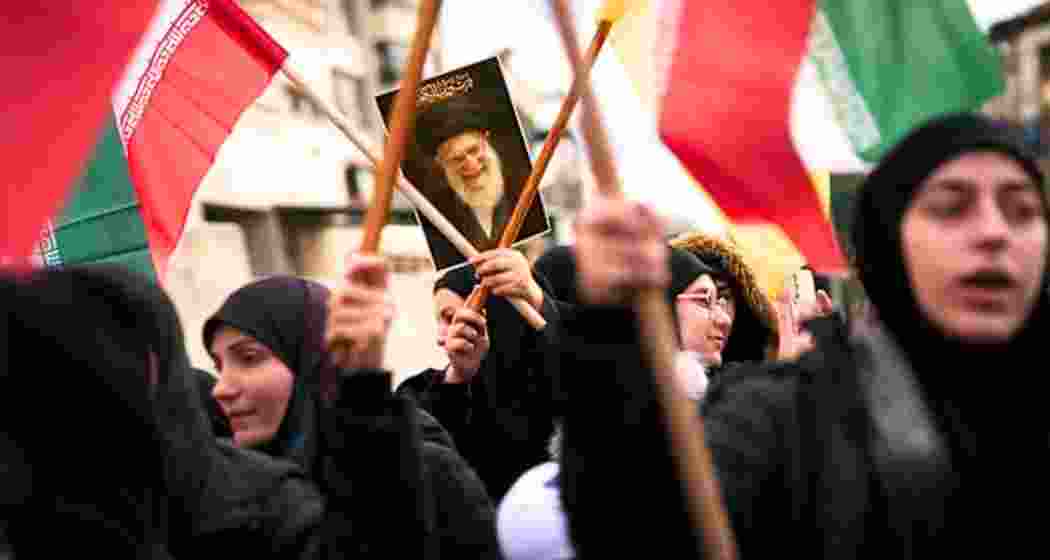 Protesters hold up portrait of former Iranian supreme leader Ayatollah Ali Khamenei during a rally as widespread demonstrations sweep Iran.(File photo)