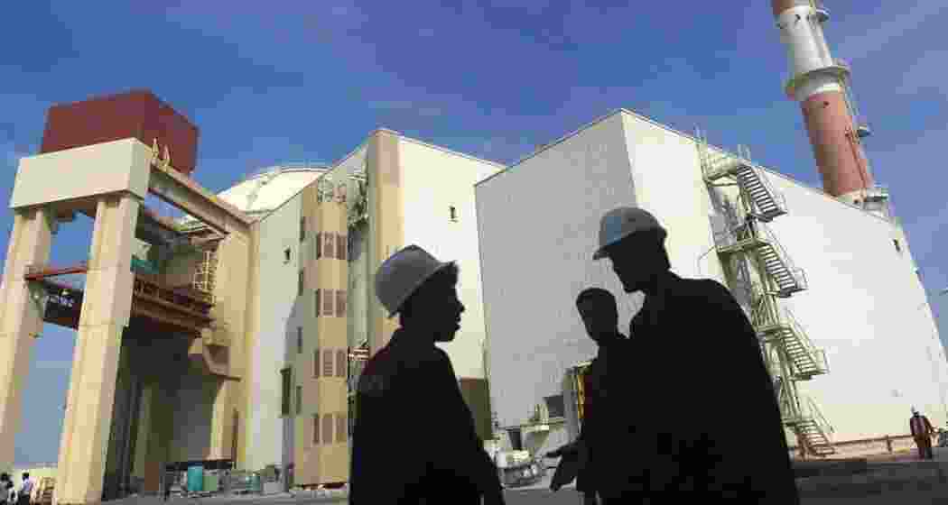 Workers are seen outside an Iranian nuclear facility.