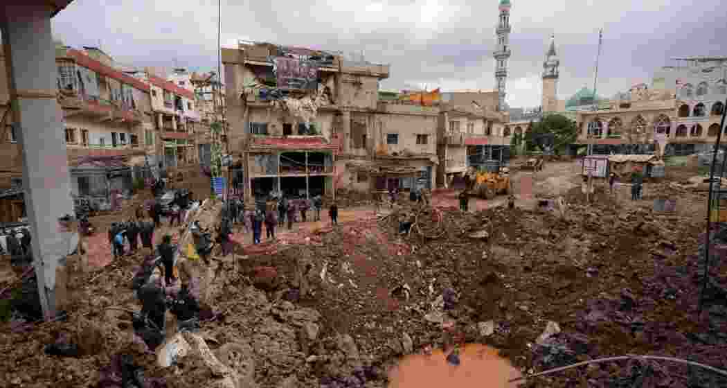 People inspect damage from an airstrike in Nabi Chit, Lebanon, on Saturday.