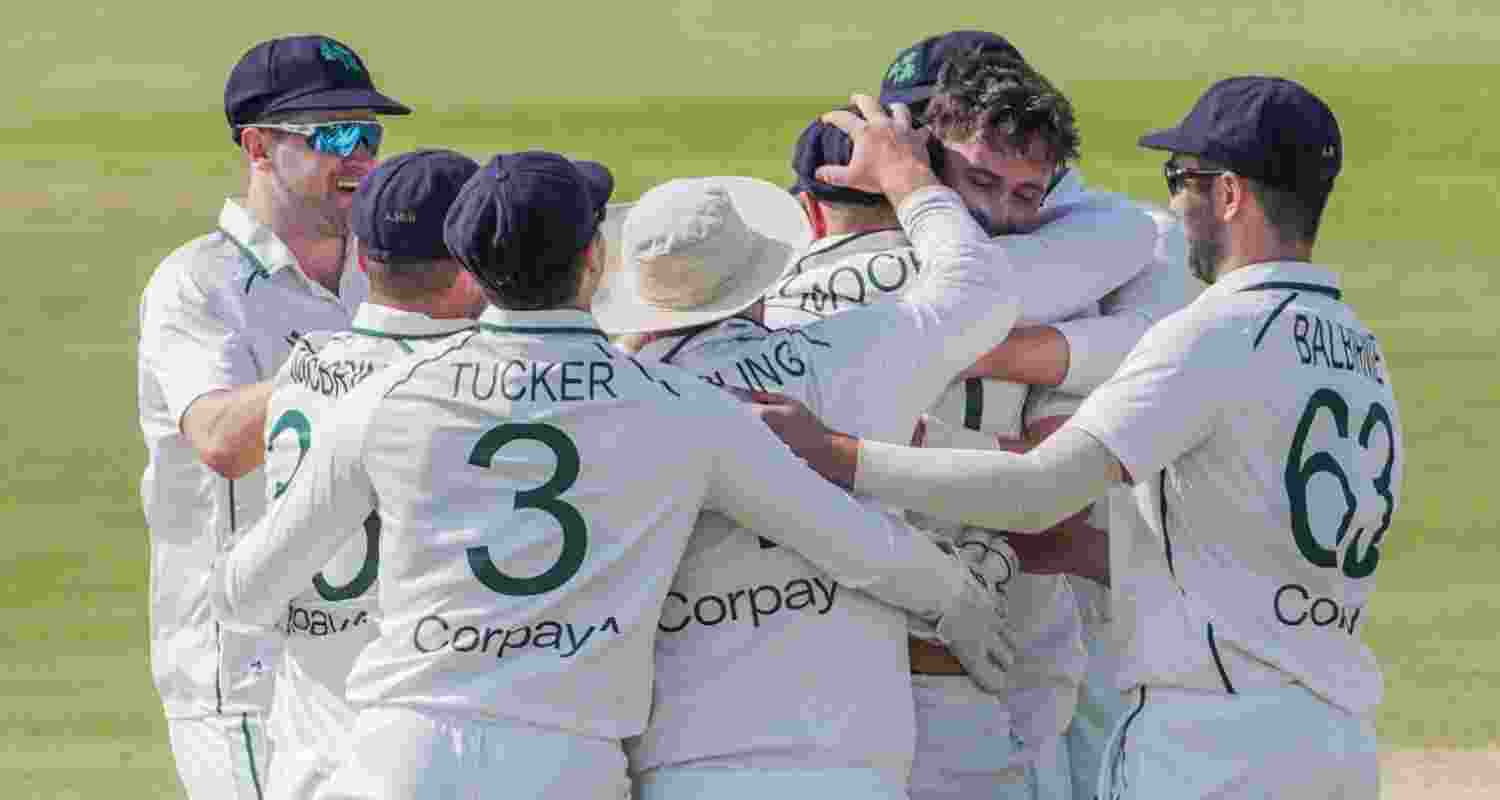 Ireland team celebrate their first Test victory. Image via Ireland Cricket on X.