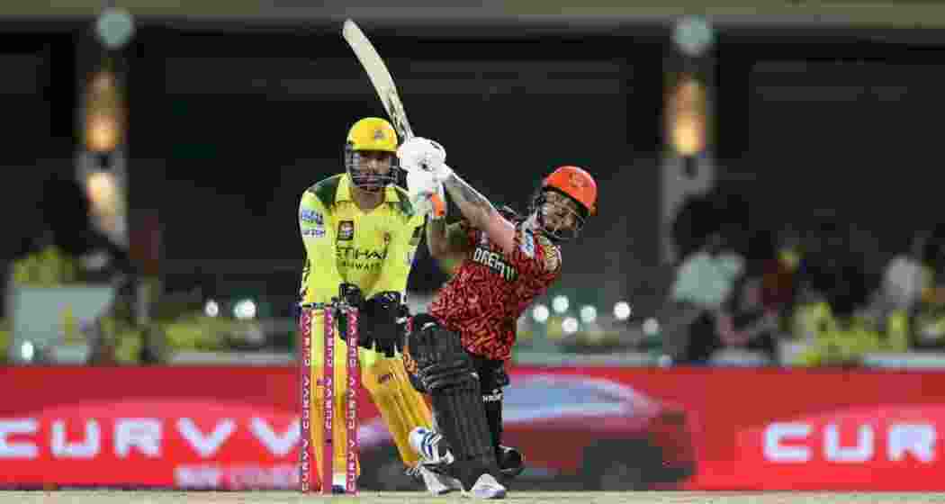 Sunrisers Hyderabad batter Ishan Kishan powers a shot as Chennai Super Kings wicketkeeper MS Dhoni looks on during their IPL clash at Chepauk, Chennai. SRH secured a crucial five-wicket win.