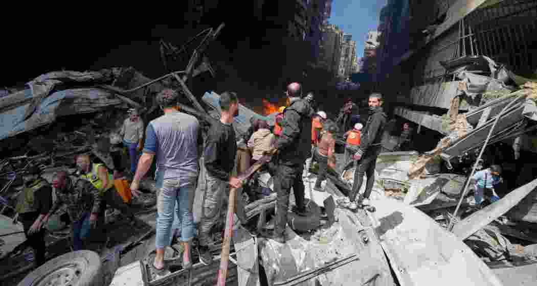 First responders search at the site of an Israeli airstrike that struck an apartment building in Beirut, Lebanon, on Wednesday.