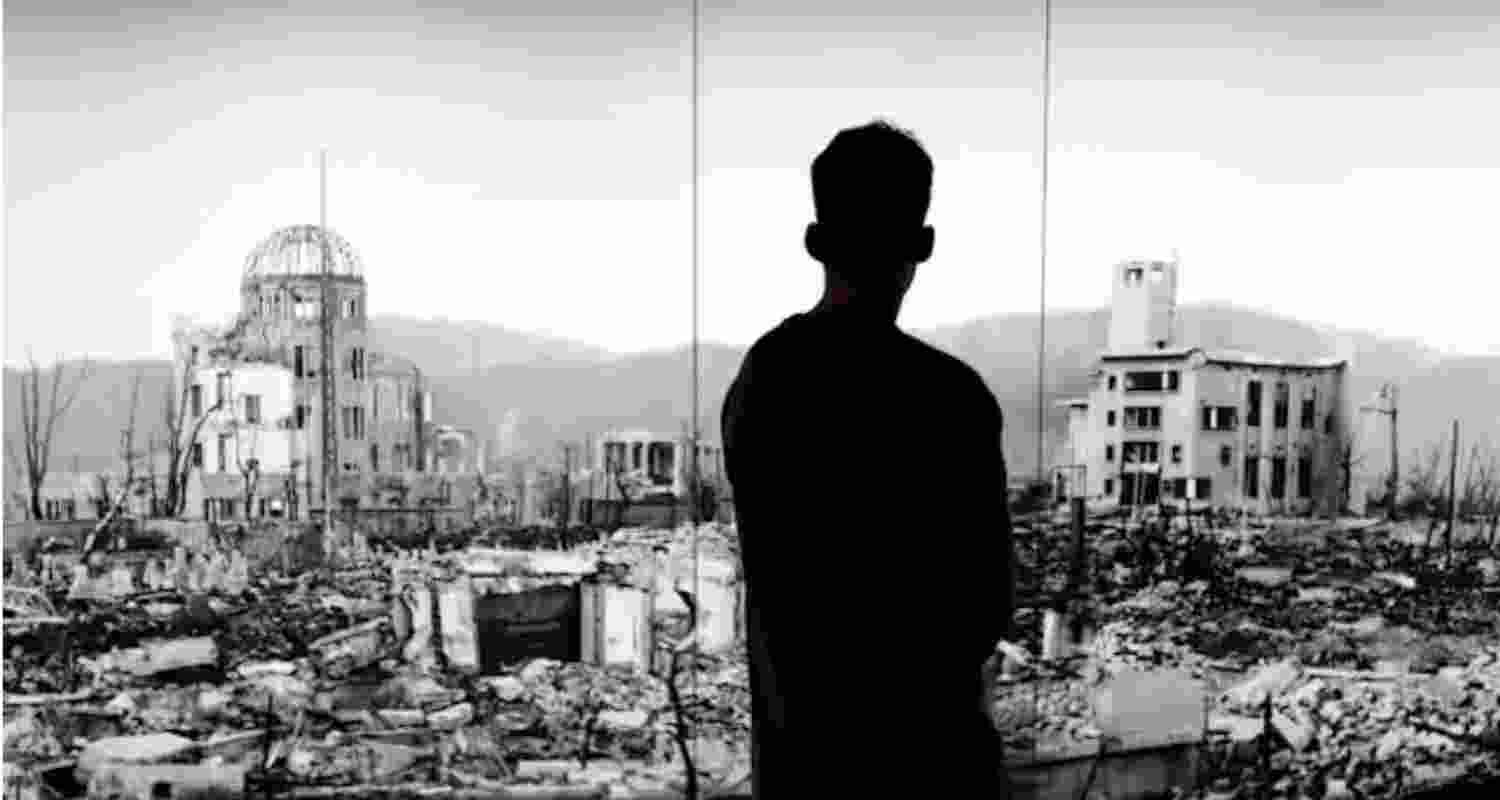 A visitor looks at a picture of Hiroshima devastated by the world’s first atomic bombing at the Hiroshima Peace Memorial Museum in Hiroshima, Japan.